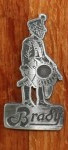 Brady metal drummer man badge